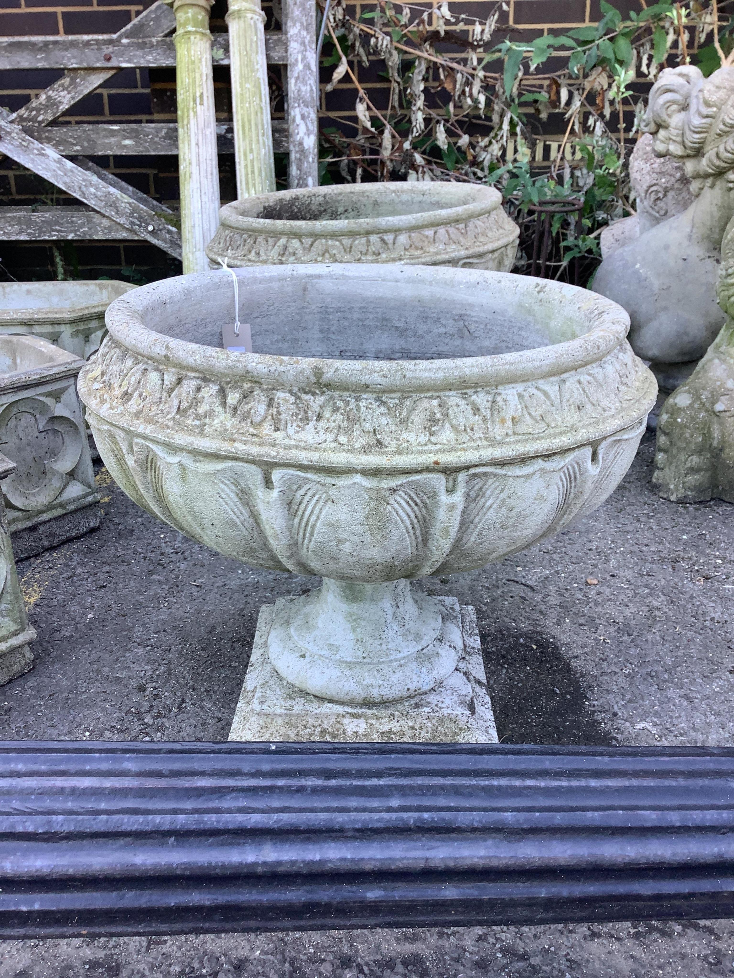 A pair of circular reconstituted stone garden planters, diameter 54cm, height 46cm. Condition - poor to fair